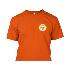 Front of an orange T-shirt featuring a small SBCLT logo