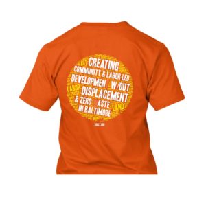 Back of an orange T-shirt featuring a large SBCLT logo